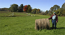 farmer with hay bale